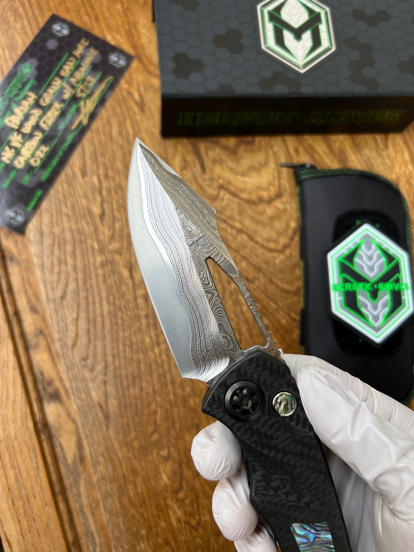 Heretic Knives Pariah Custom M/A Button Lock Carbon Fiber & Abalone Inlay w/ Vegas Forge Wood Grain San Mai Damascus
